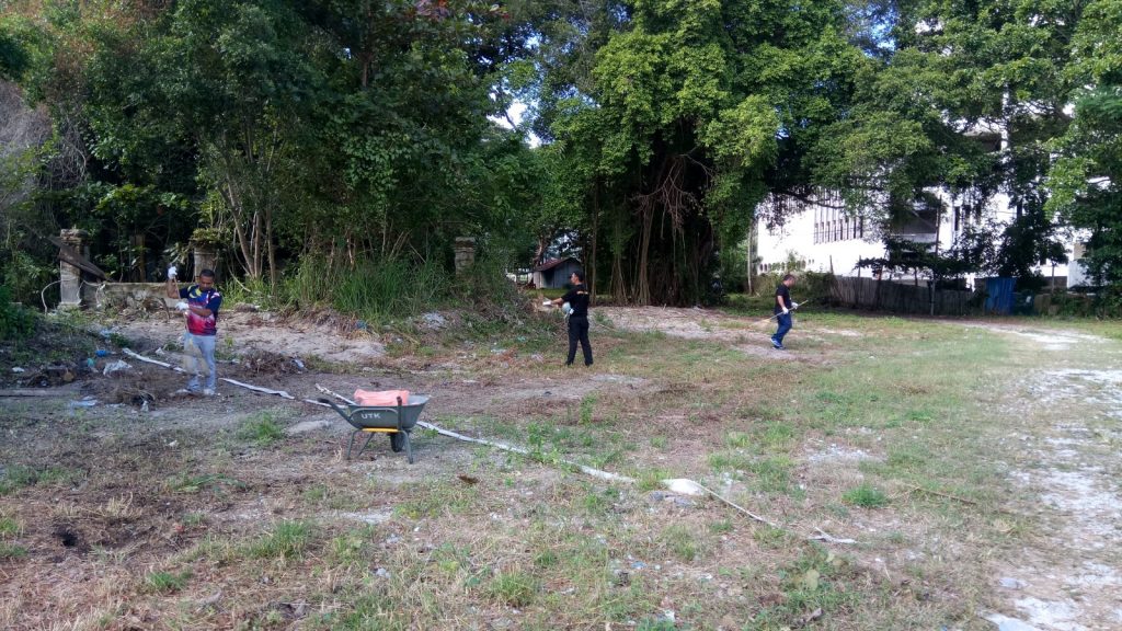 Bahang Bay hotel staff sweeping the area.