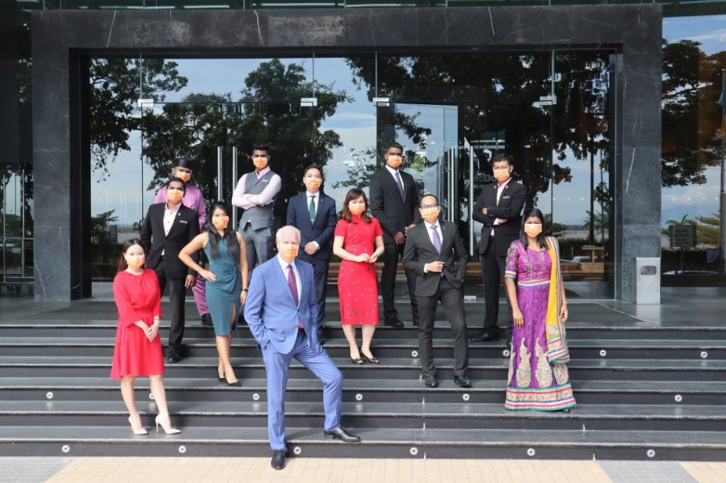 G Hotel team with face masks at all times