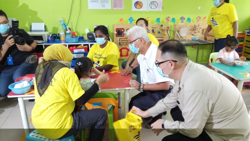 Phee meeting some of the children at the home.