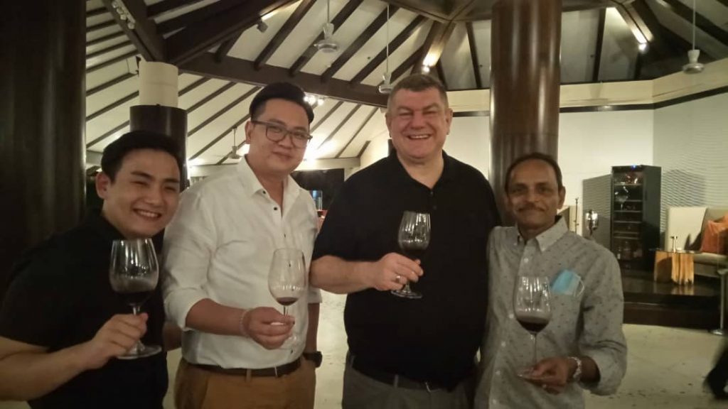 MD Frank Beck (second from right) with guests.