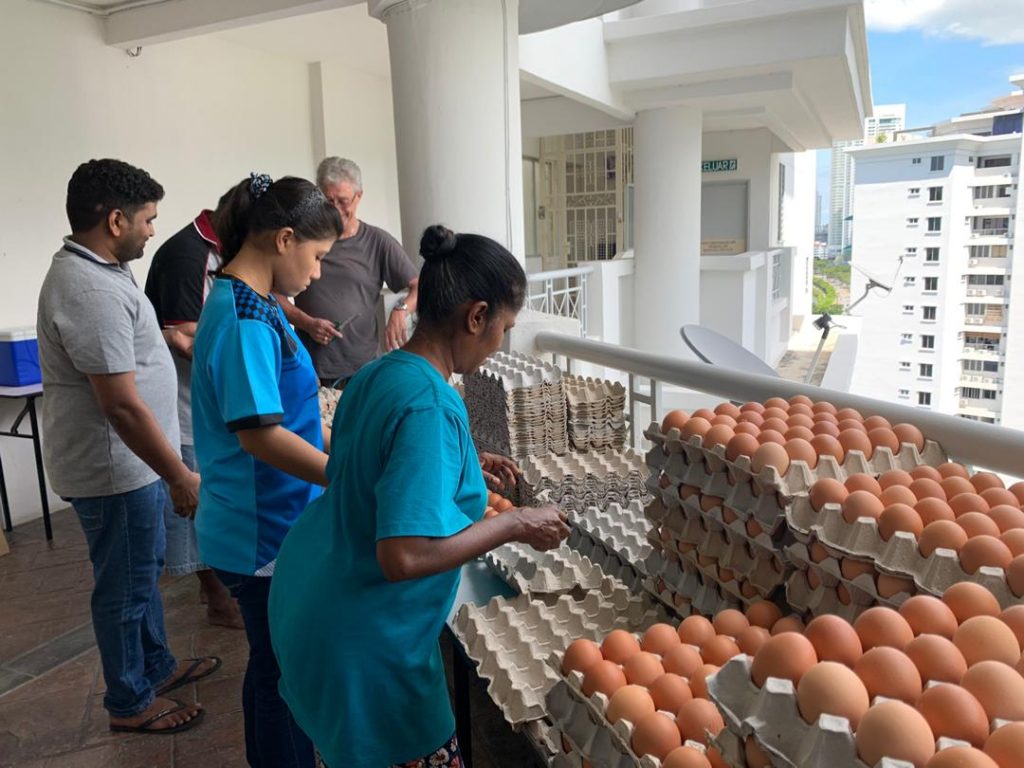 Family and friends packing the food items.
