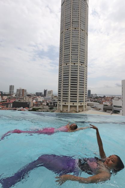 'Mermaids' at the highest cantilevered acrylic bottom swimming pool in Malaysia is at The Granite Luxury Hotel.